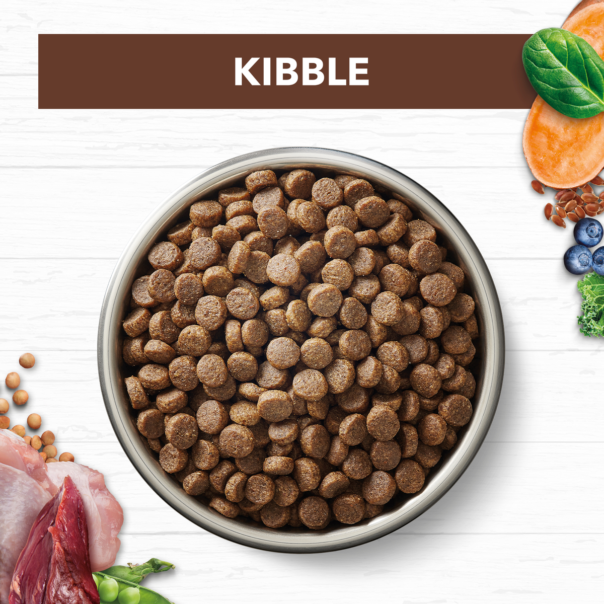 Ivory Coat Grain Free Chicken and Kangaroo kibble in a bowl with raw ingredients