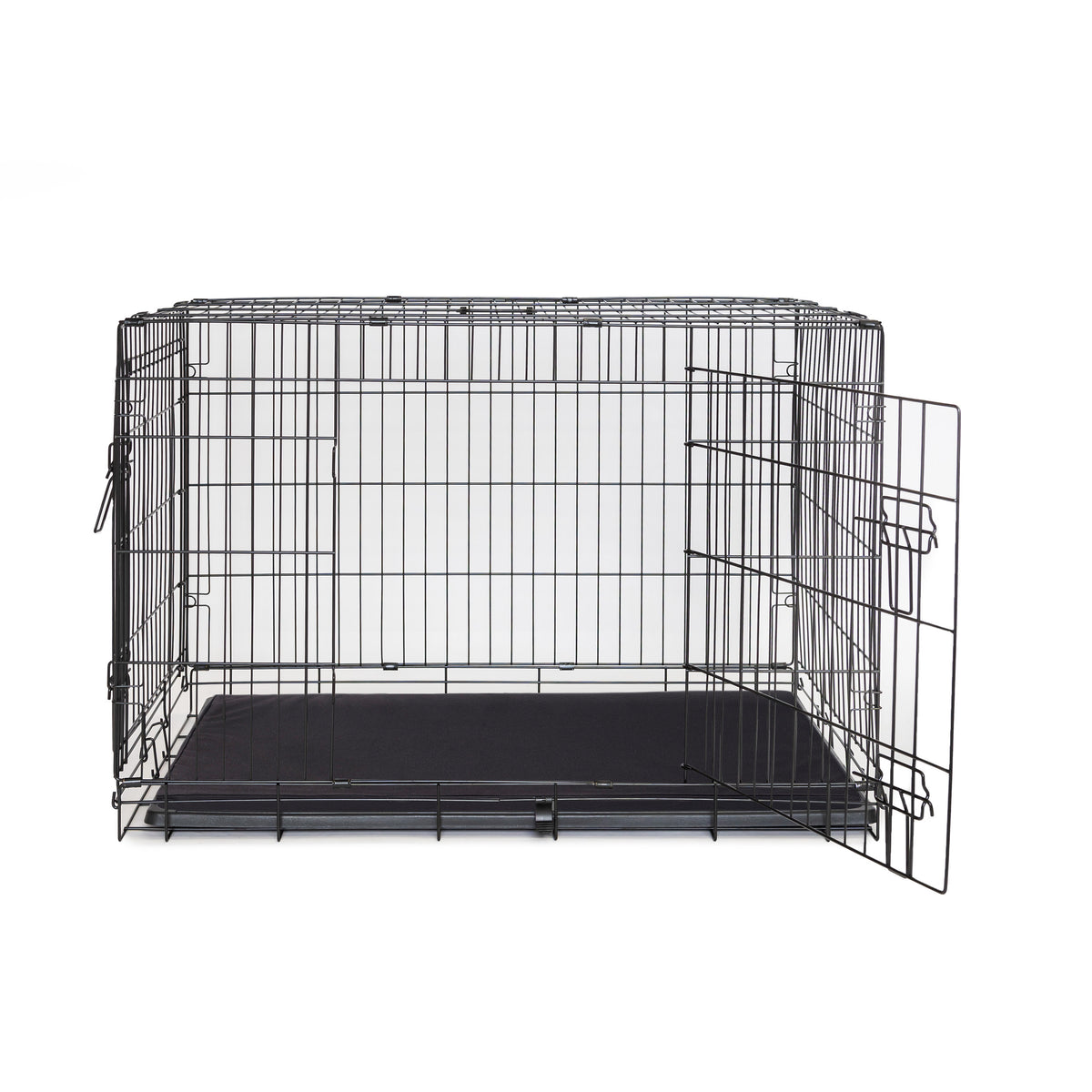 A wire dog crate with a Superior Pet Goods Crate Mat Canvas in the base