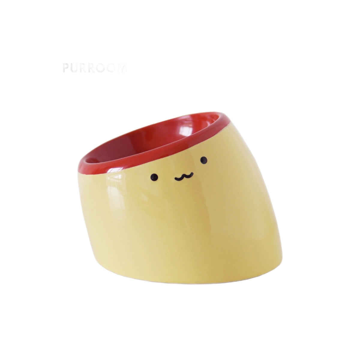 Purroom Elevated Pudding Ceramic Pet Bowl, tilted ceramic bowl on a pudding-shaped stand