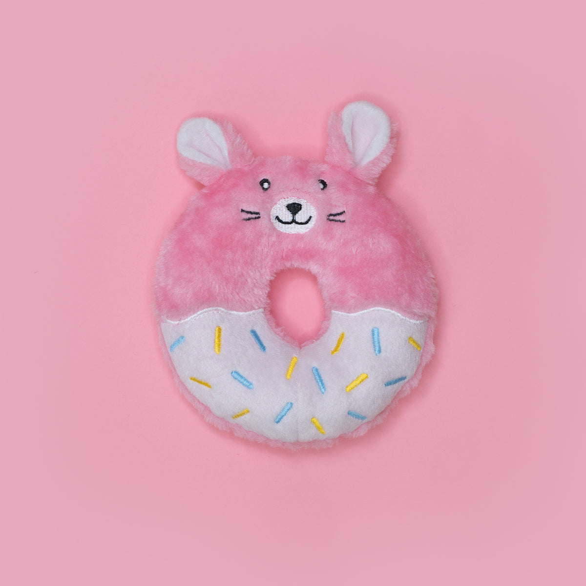 Dog holding the Zippy Paws Donutz Buddies Bunny