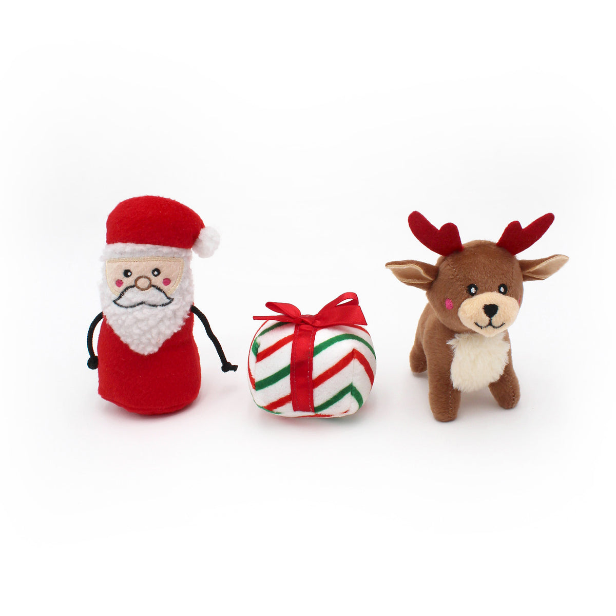 The three squeaky toys that come with the sleigh: Santa, a present and a reindeer