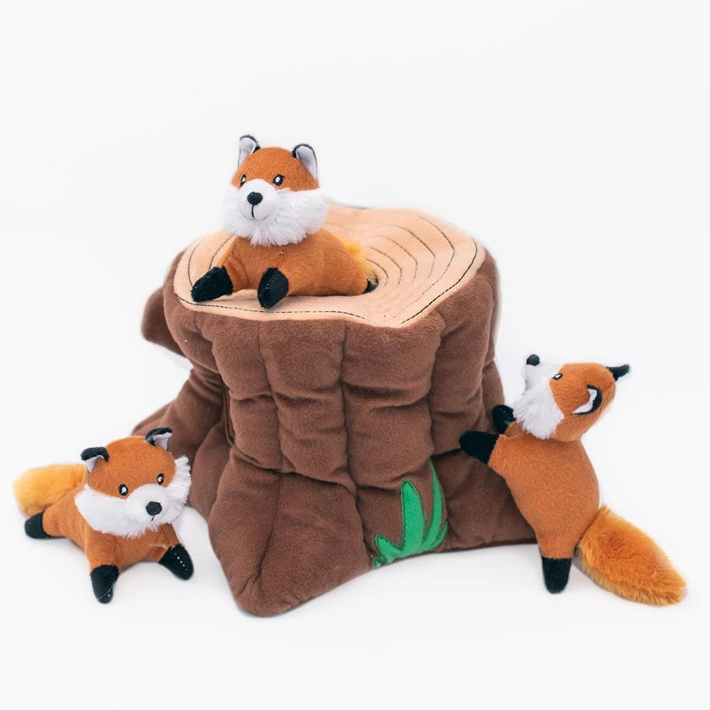 Zippy Paws Burrow plush dog toy: a tree stump with three squeaky foxes