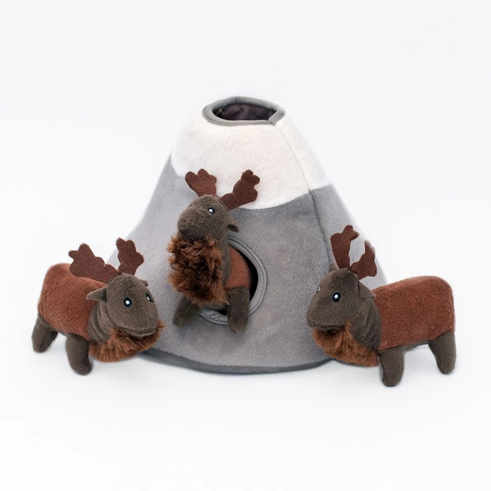 Zippy Paws Burrow elk mountain dog toy with its squeaky elk beside the opening