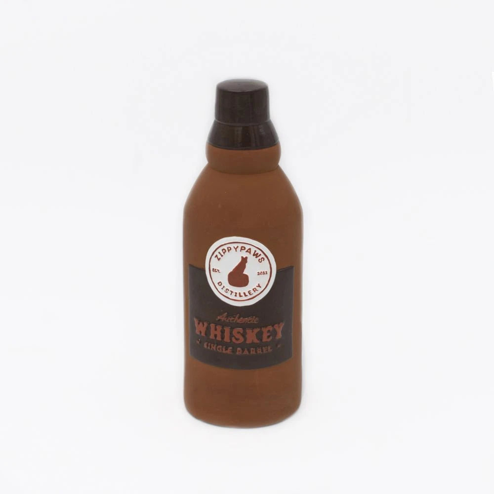 Zippy Paws Happy Hour Crusherz latex dog toy shaped as a whiskey bottle, on white
