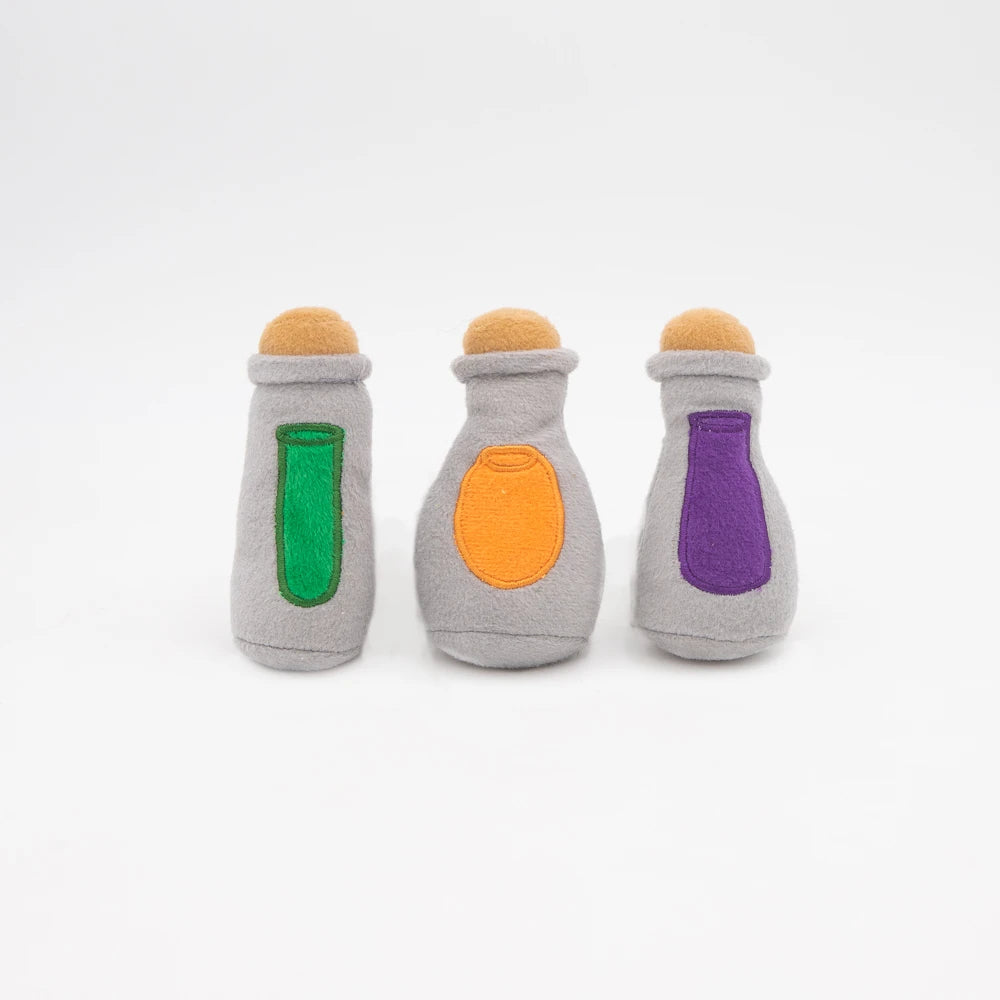 The three plush potion bottle squeakers from the Zippy Paws Burrow witch's brew dog toy