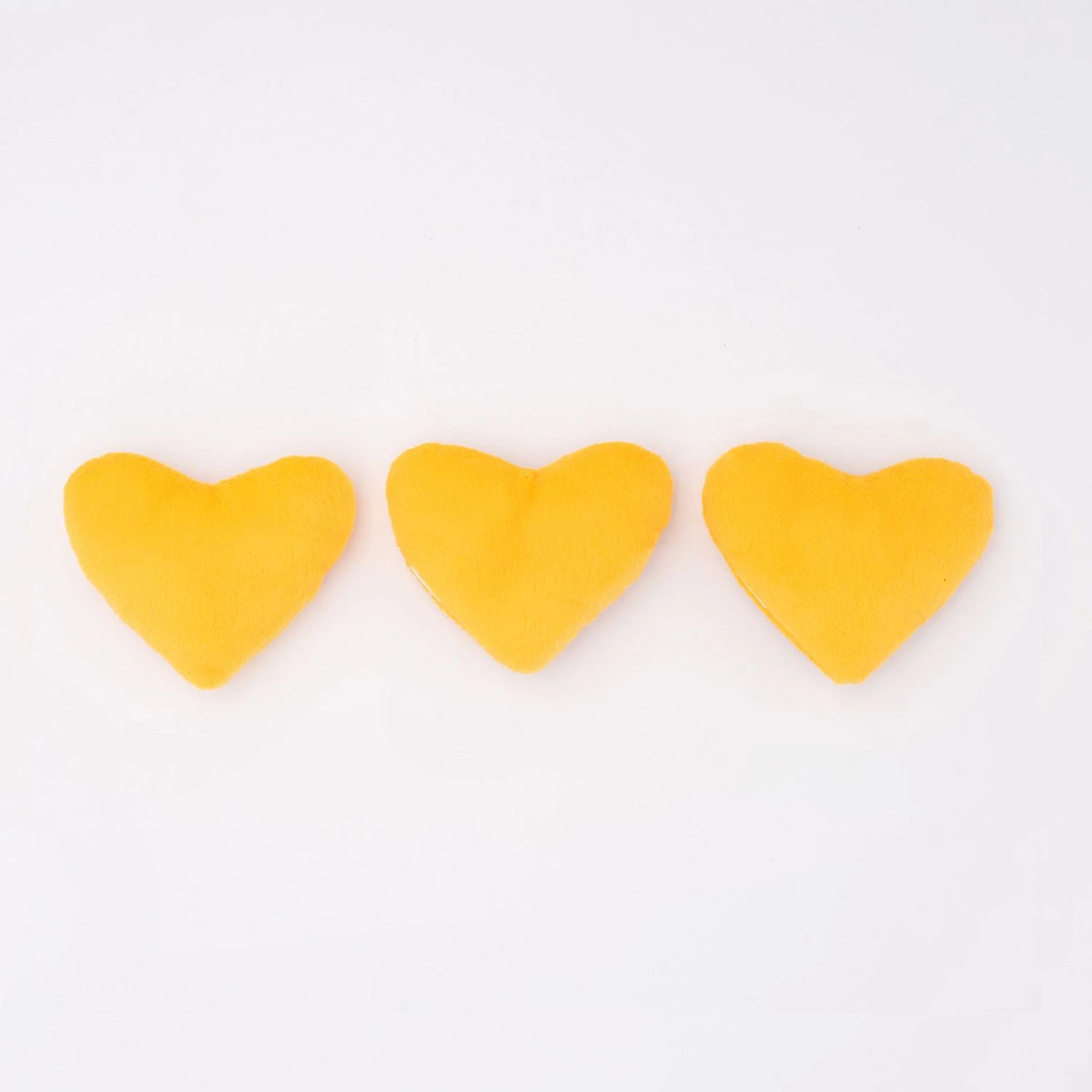 Three Zippy Paws Miniz heart-shaped plush cookie dog toys, plain golden reverse side