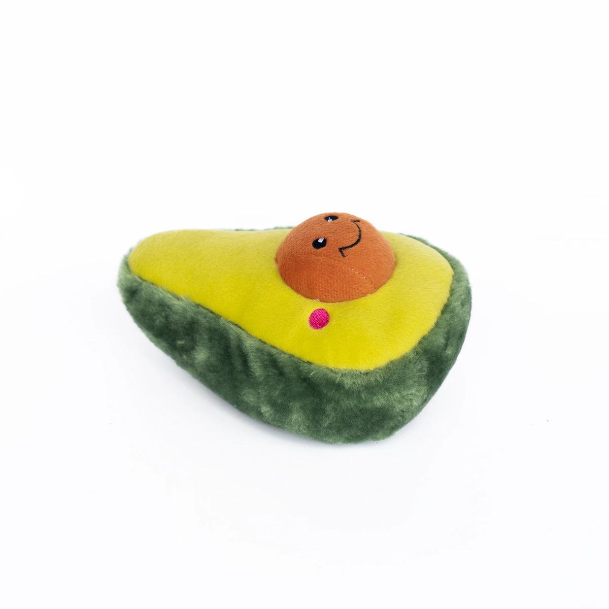 Zippy Paws NomNomz plush avocado dog toy lying down, showing its stone and face