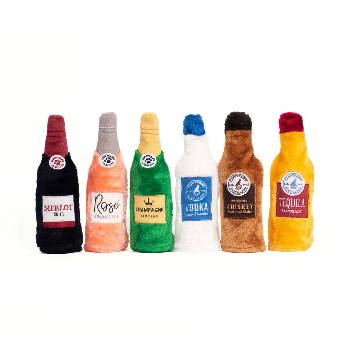 Six Zippy Paws Happy Hour Crusherz plush bottle dog toys lined up side by side
