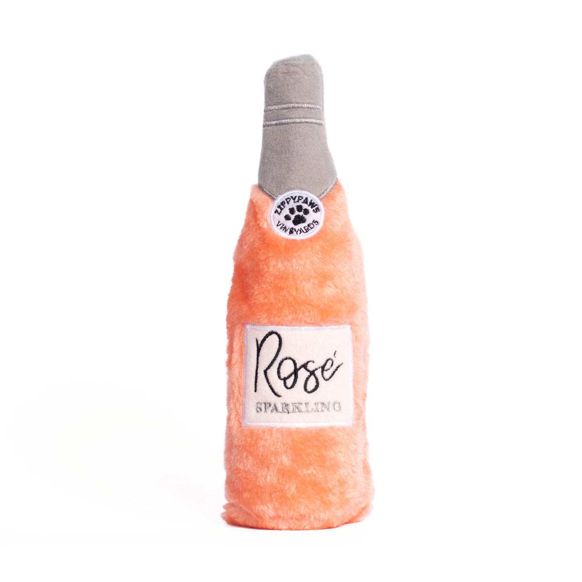 Zippy Paws Happy Hour Crusherz plush dog toy shaped as a sparkling rose bottle, on white