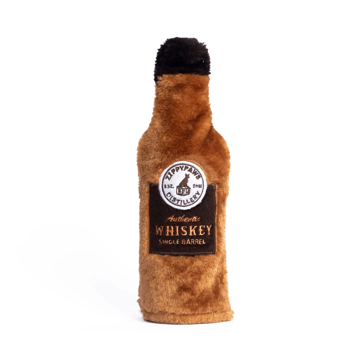 Zippy Paws Happy Hour Crusherz plush dog toy shaped as a whiskey bottle, on a white background