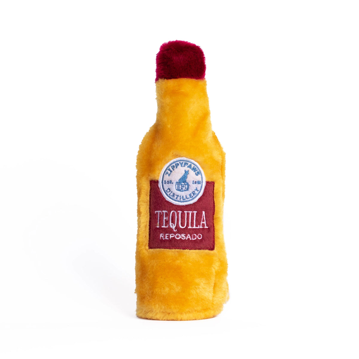Zippy Paws Happy Hour Crusherz plush dog toy shaped as a tequila bottle, on a white background