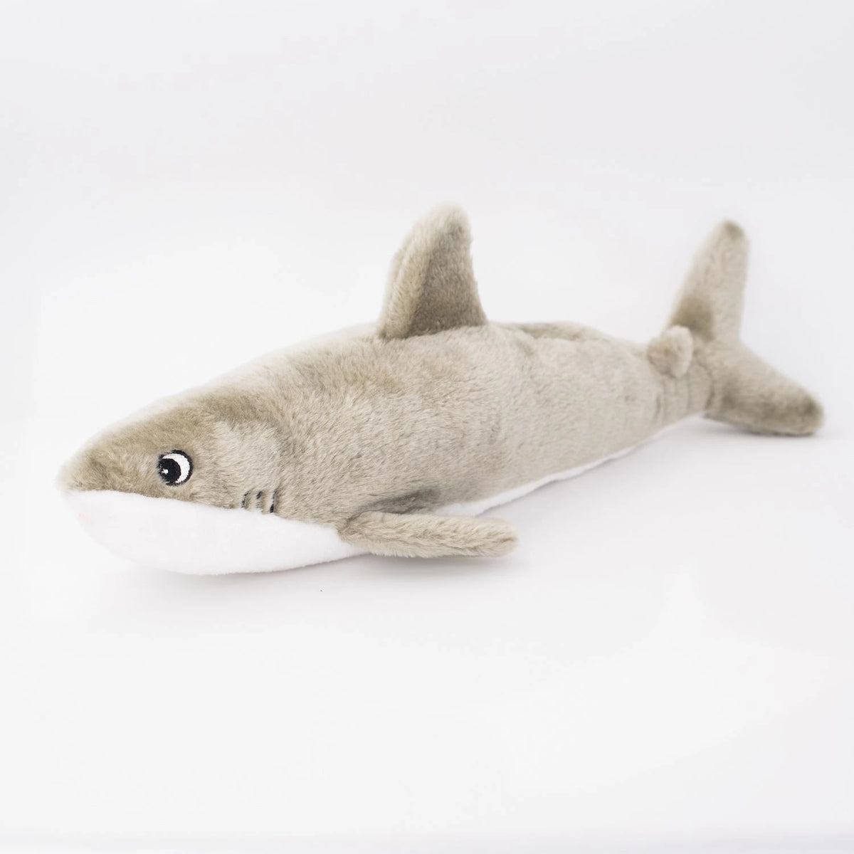 Zippy Paws Jigglerz plush grey shark dog toy seen from the other side, on white