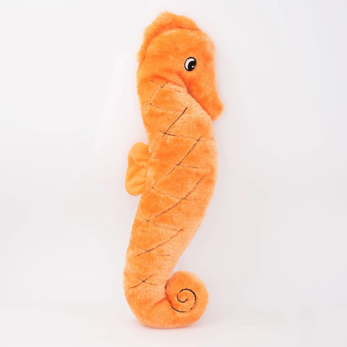 Zippy Paws Jigglerz plush seahorse dog toy in orange, shown on a white background