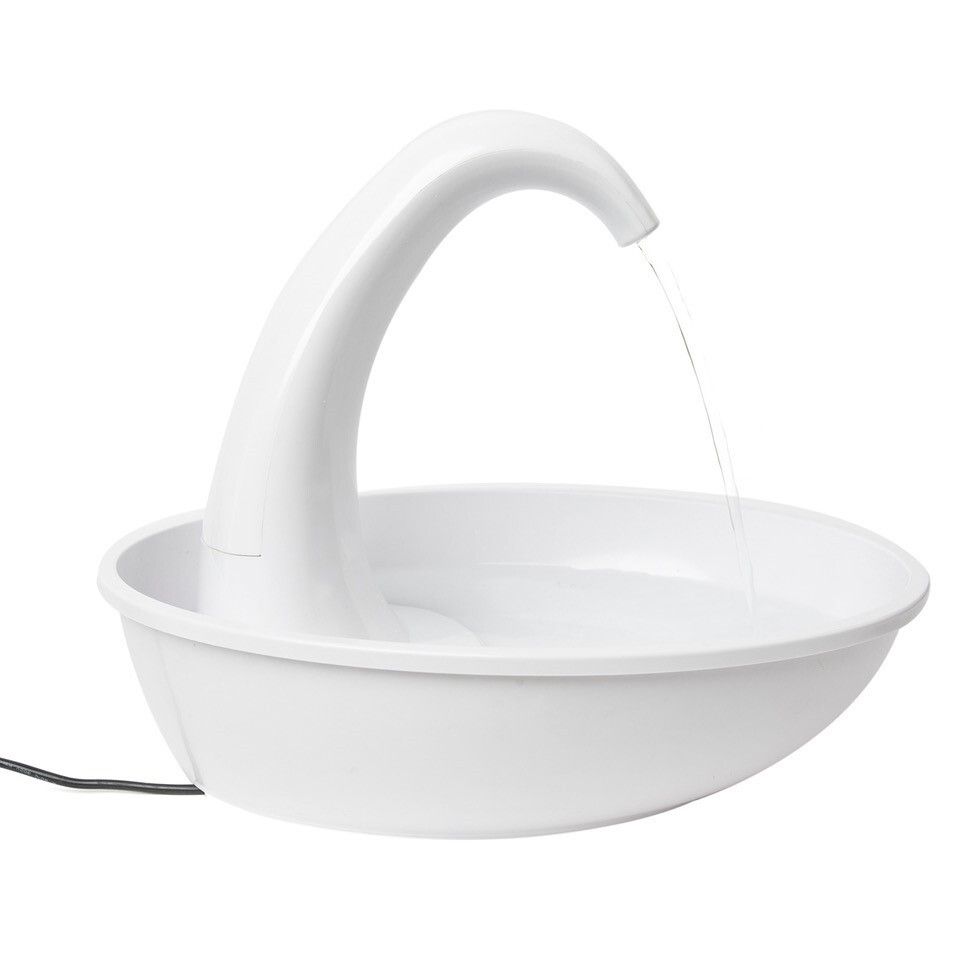 White Pioneer Pet Swan plastic fountain running, water arcing from the swan neck spout into the bowl