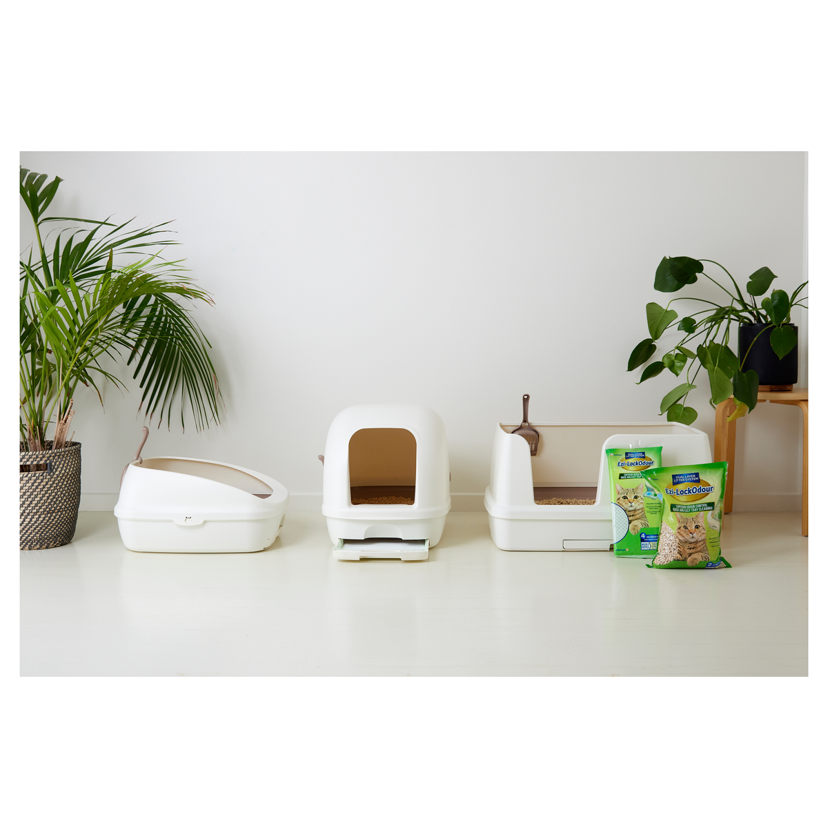 Ezi-LockOdour hooded box, XL tray and a pack of pellets styled in a room with plants