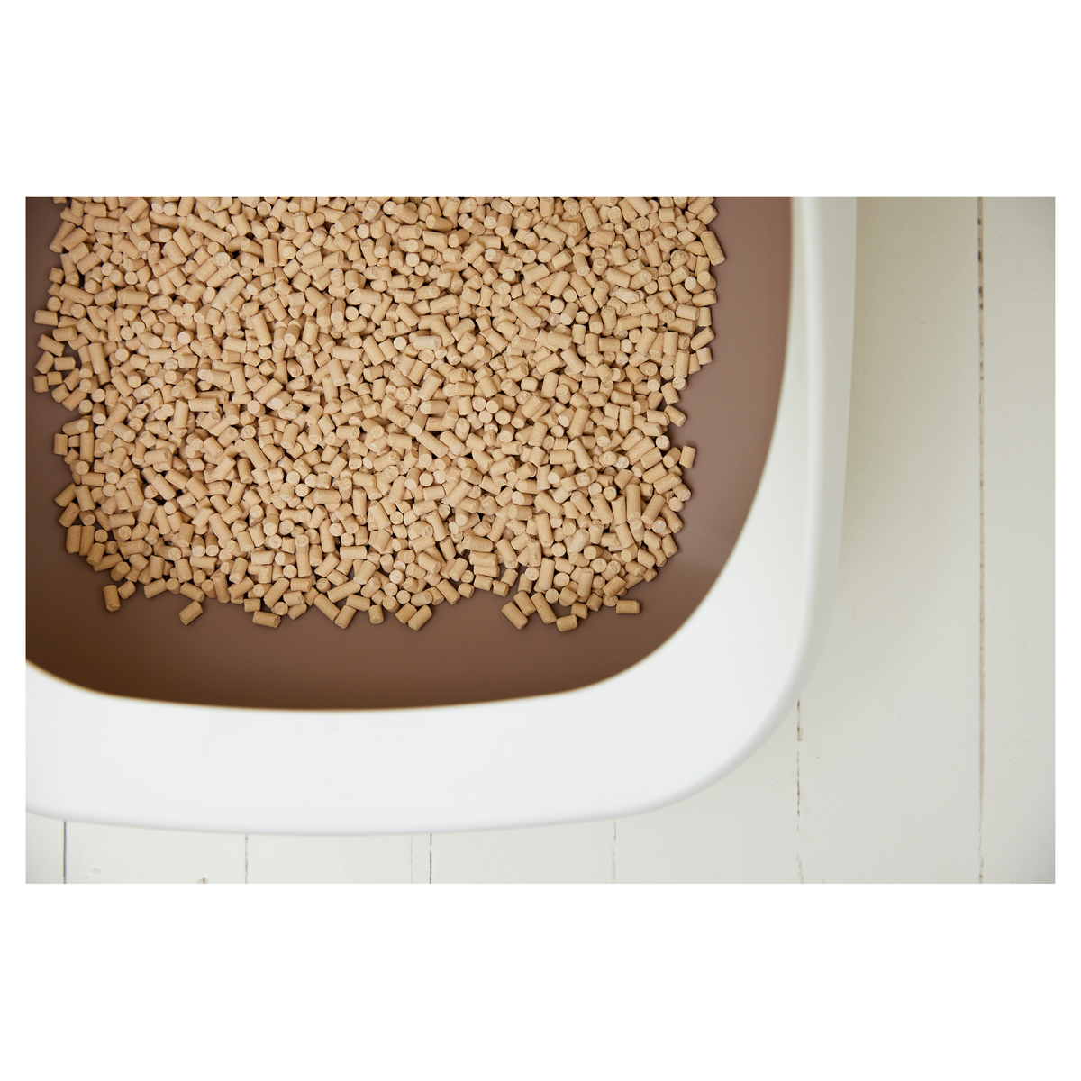 Close up of zeolite pellets filling a brown Ezi-LockOdour litter tray