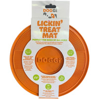 Doggi Lickin' Treat Mat in its retail pack, a round grooved orange mat on a printed card