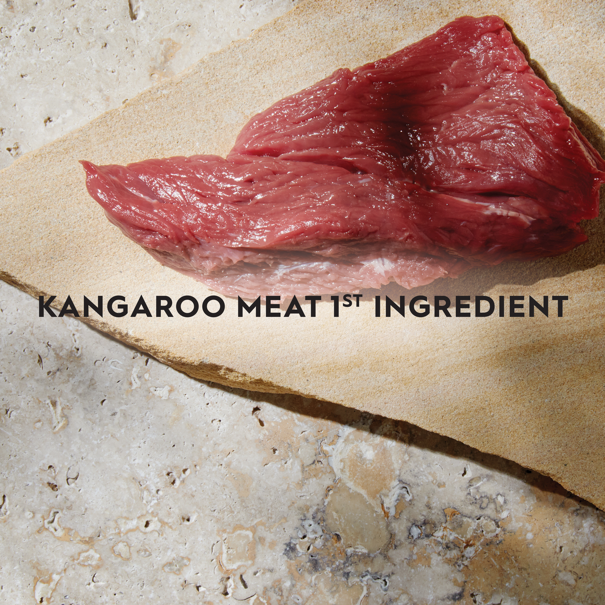 Raw kangaroo meat on hessian with the caption kangaroo meat first ingredient
