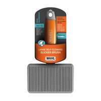 Wahl large self-cleaning slicker brush in its retail packaging with the grey slicker pad below