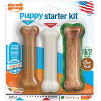 Front of the Nylabone Puppy Starter Kit pack, two chew bones and a Healthy Edibles chew treat