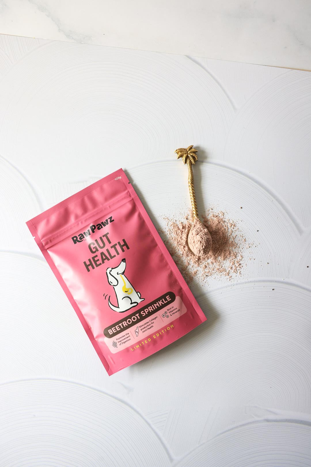 Raw Pawz beetroot meal topper sprinkled over a dog bowl