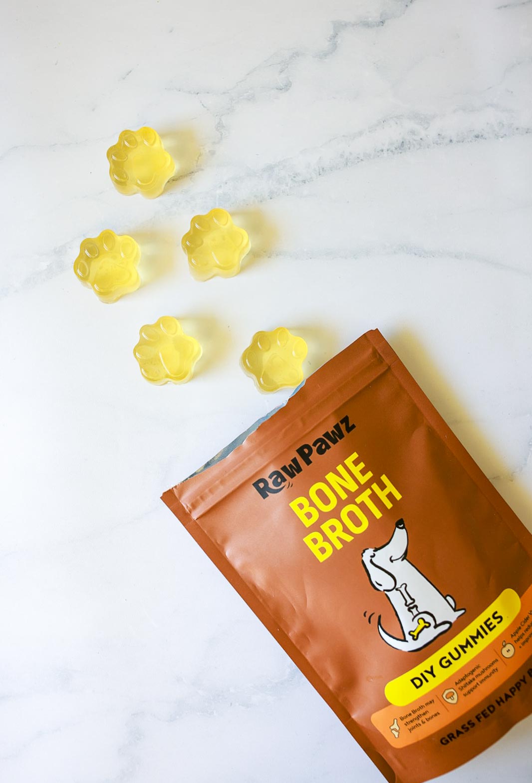 Set Raw Pawz bone broth gummies on a plate