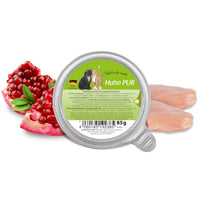 GranataPet Filet A La Carte Chicken PUR 85g tray with two raw chicken breasts and a halved pomegranate