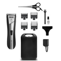 Wahl Lithium Home Pet clipper kit laid out with guide combs, scissors, blade oil, brush and storage case