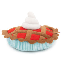 Zippy Paws plush dog toy shaped as a lattice pie with whipped cream, on a white background