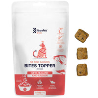 Korure Pets NZ King Salmon Bites Topper for cats, white and red pouch with loose cube treats.