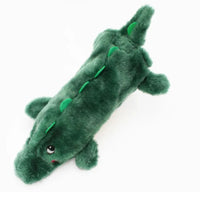Zippy Paws Bottle Crusherz plush dog toy shaped as a green alligator, seen from above