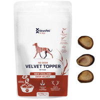 Korure Pets NZ Deer Velvet Topper for dogs, white and red pouch with velvet slices beside it.