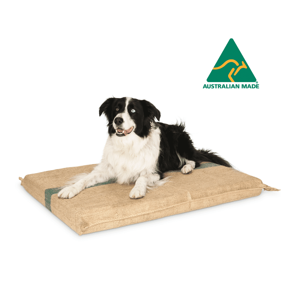 A border collie lying on the Superior Pet Goods Extra Thick Hessian Dog Mat, Australian Made logo