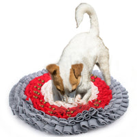 A white terrier digging in the All for Paws AFP Dig It round fluffy mat in grey, red and cream