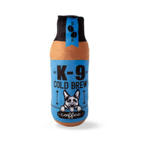 Fringe Studio K-9 Cold Brew plush dog toy, blue and orange coffee bottle with a dog graphic.