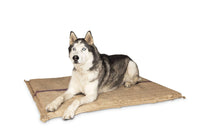 A husky lying on a Superior Pet Goods Hessian Dog Mat with a jute cover