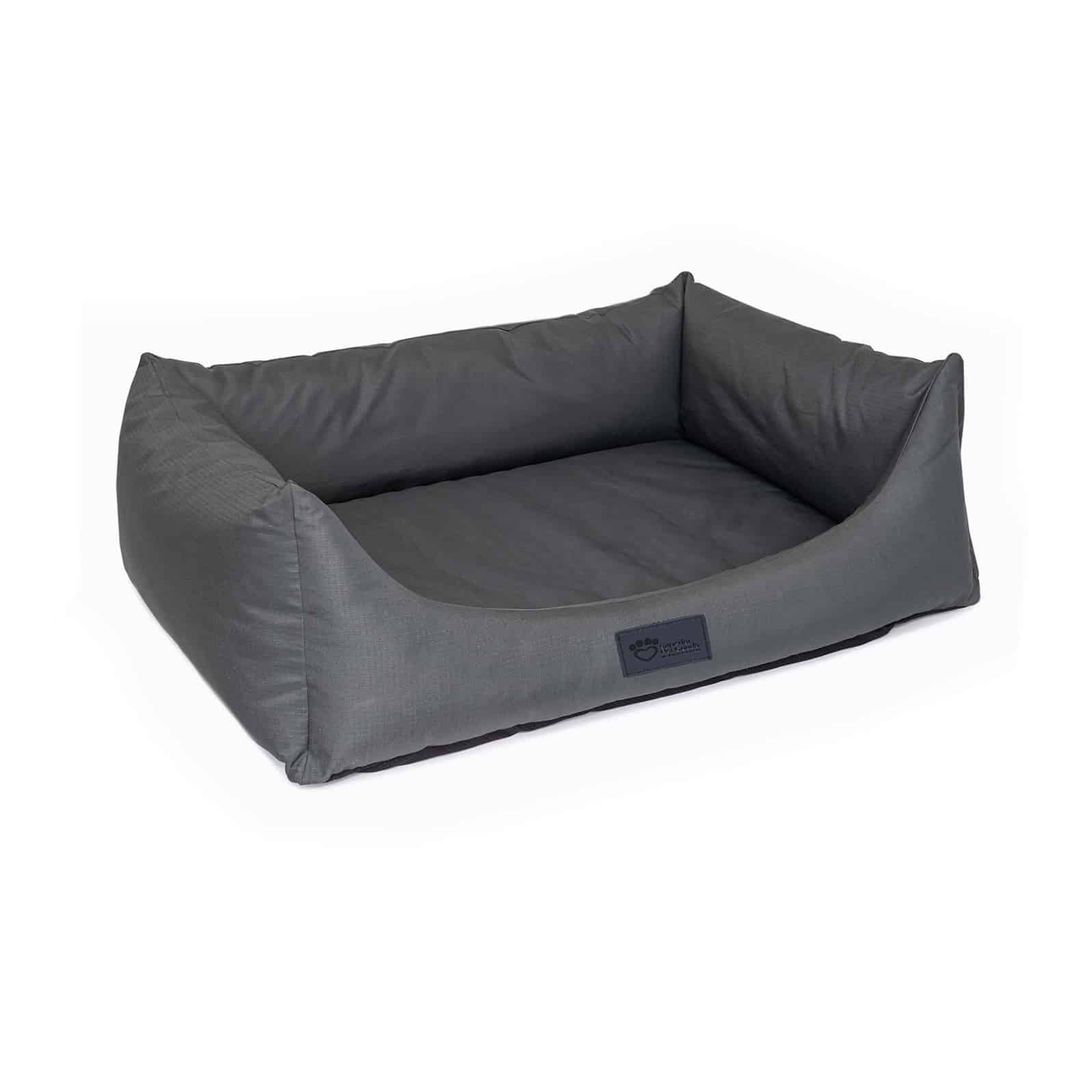 Dog settled into a Superior Pet Goods High Side Hideout Ortho Dog Bed