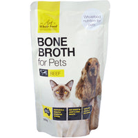 The Art of Whole Food Bone Broth for Pets, beef pouch with a cat and a spaniel