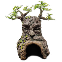 URS Old Tree Hide, resin stump hide with a carved face and foliage over the cave opening