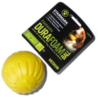 Starmark Fantastic DuraFoam Ball in yellow beside its retail card marked Medium