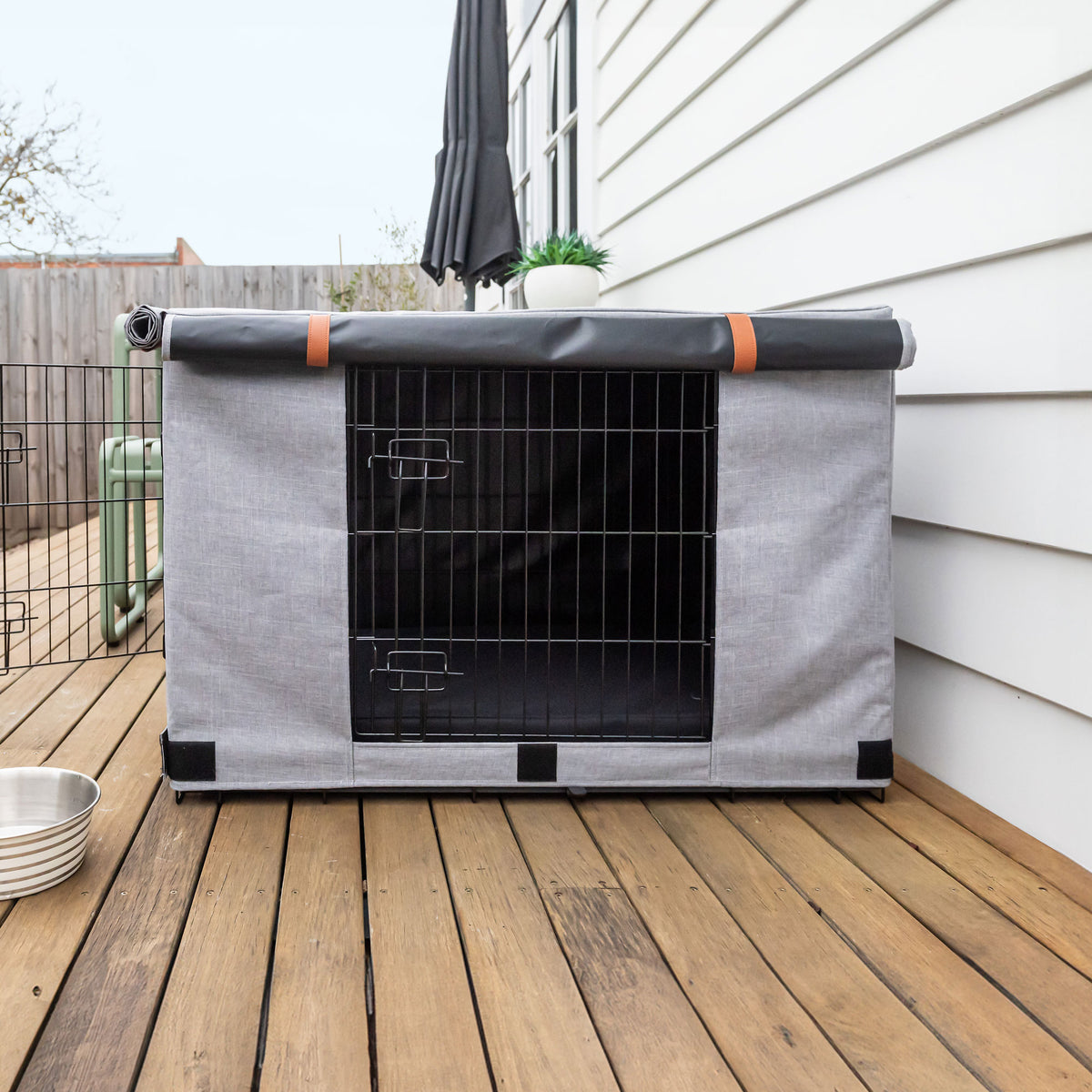 Superior Pet Goods Urban Crate Cover on a crate outdoors with the side panel rolled up