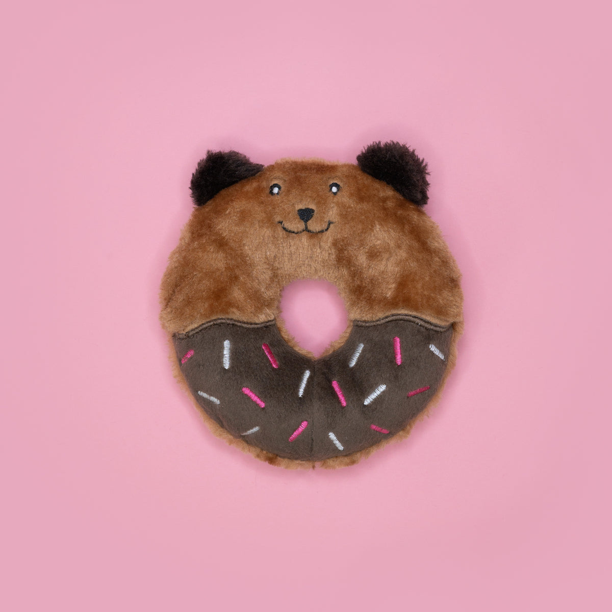 Dog holding the Zippy Paws Donutz Buddies Bear