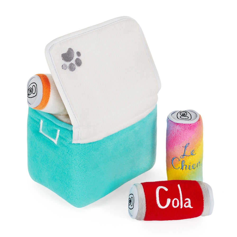 Dog nosing the Miniz toys out of the Zippy Burrow Ice Chest