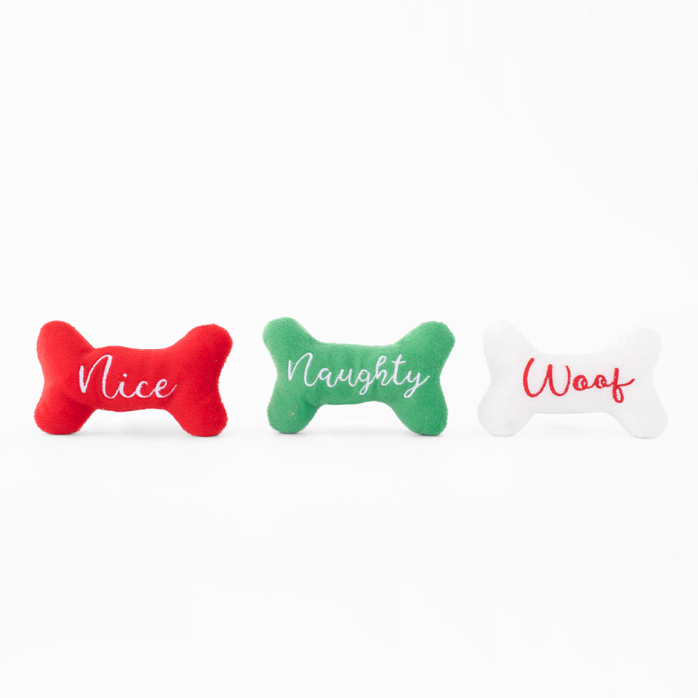 The two Naughty and Nice squeaky bone toys that come with the stocking