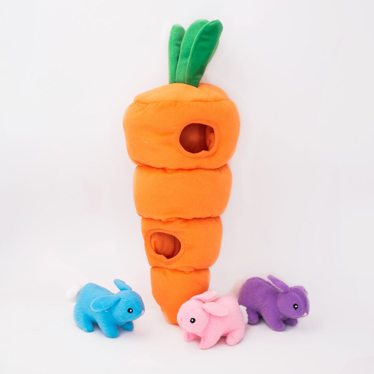 Zippy Paws Plush Burrow Easter Carrot dog toy with three squeaky bunnies