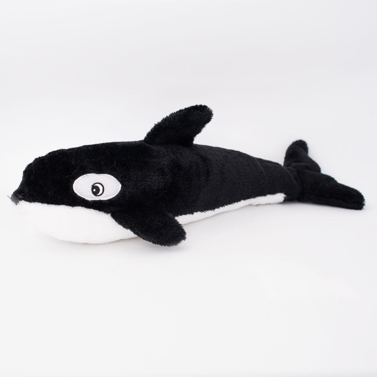 Zippy Paws Jigglerz Killer Whale dog toy, side view of the black and white plush orca