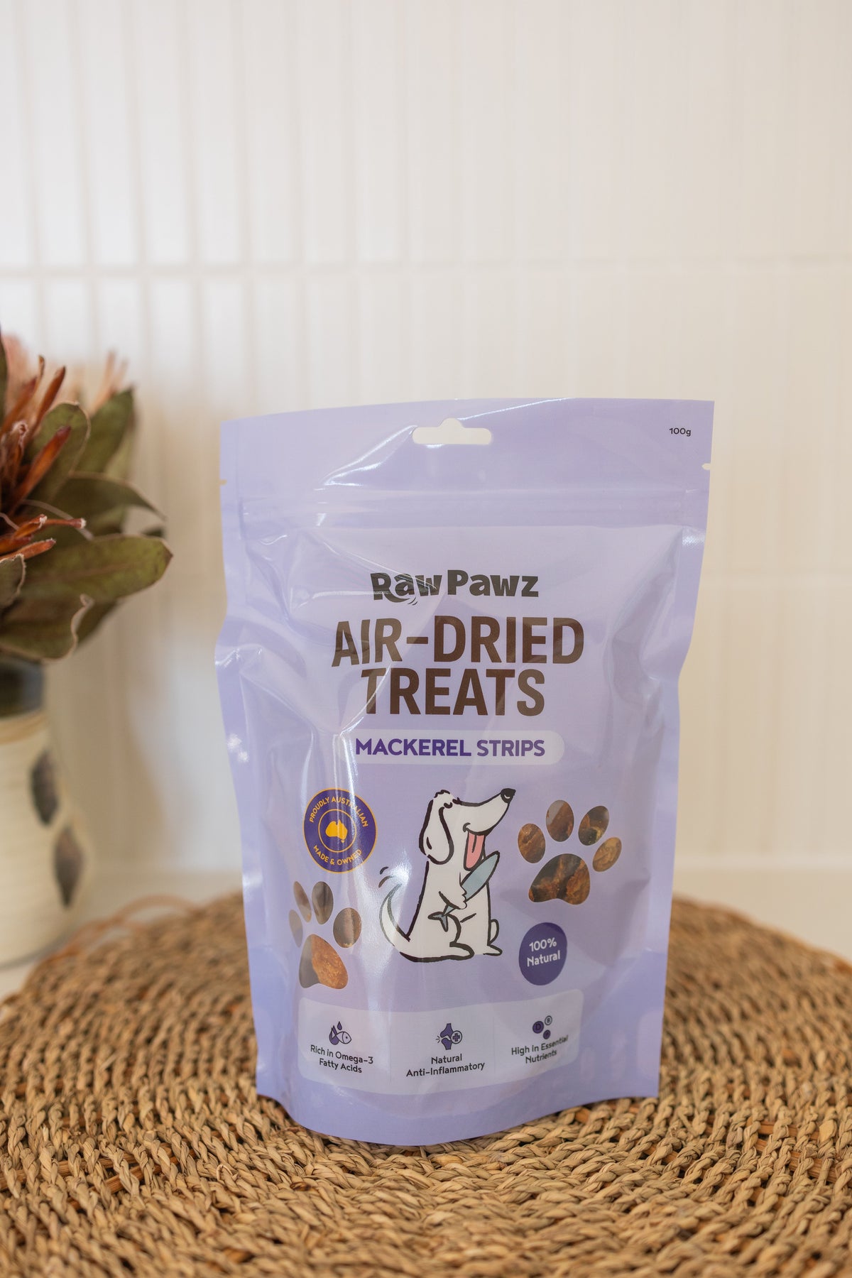 Dog being given a Raw Pawz air-dried mackerel strip