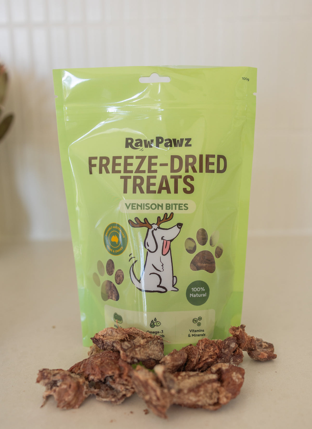 Dog being given a Raw Pawz freeze-dried venison bite