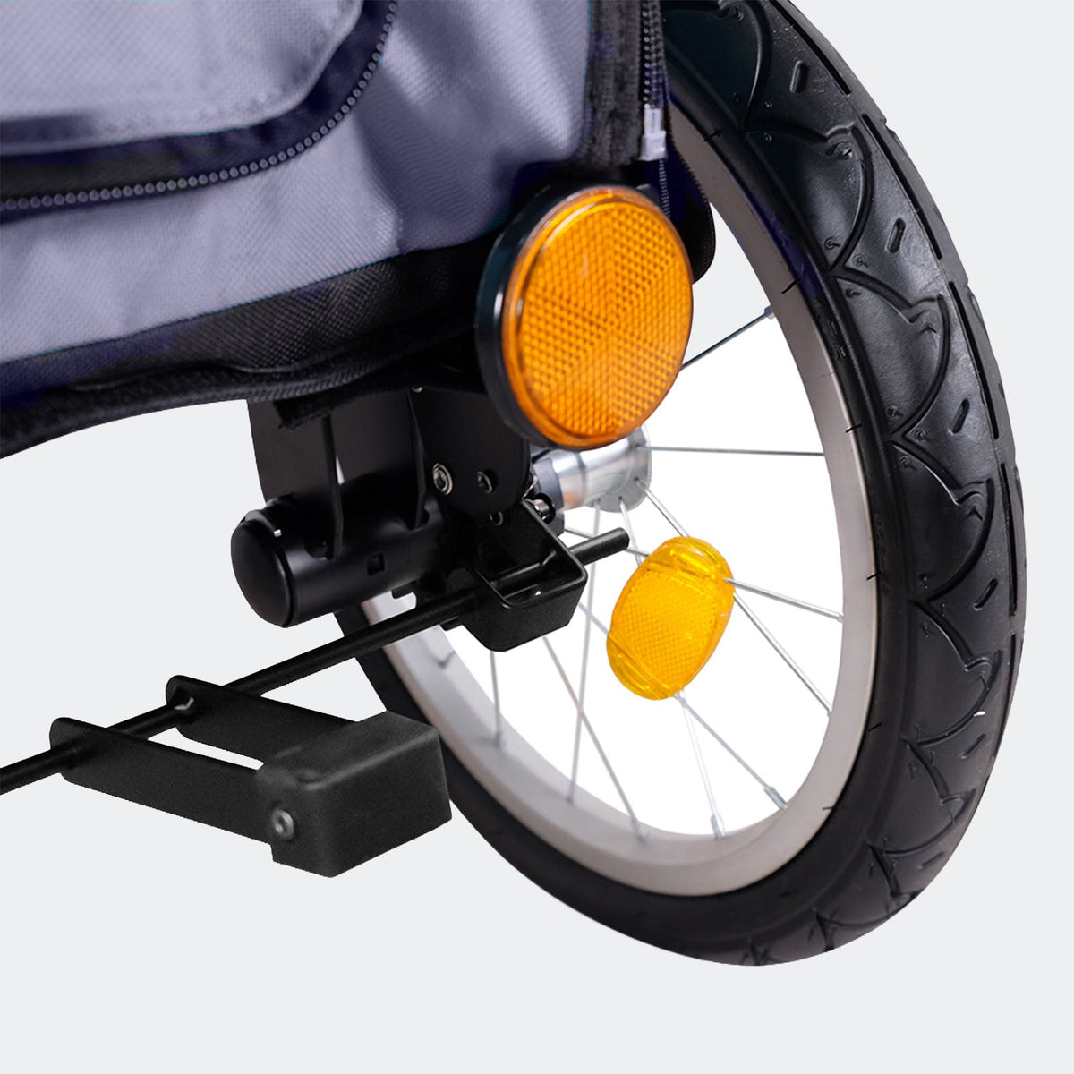 Close-up of the quick-release wheel and reflector on the Ibiyaya Happy Pet Tri-cycle