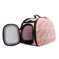Ibiyaya Classic collapsible shoulder pet carrier in pink floral with the mesh side panel unzipped and open